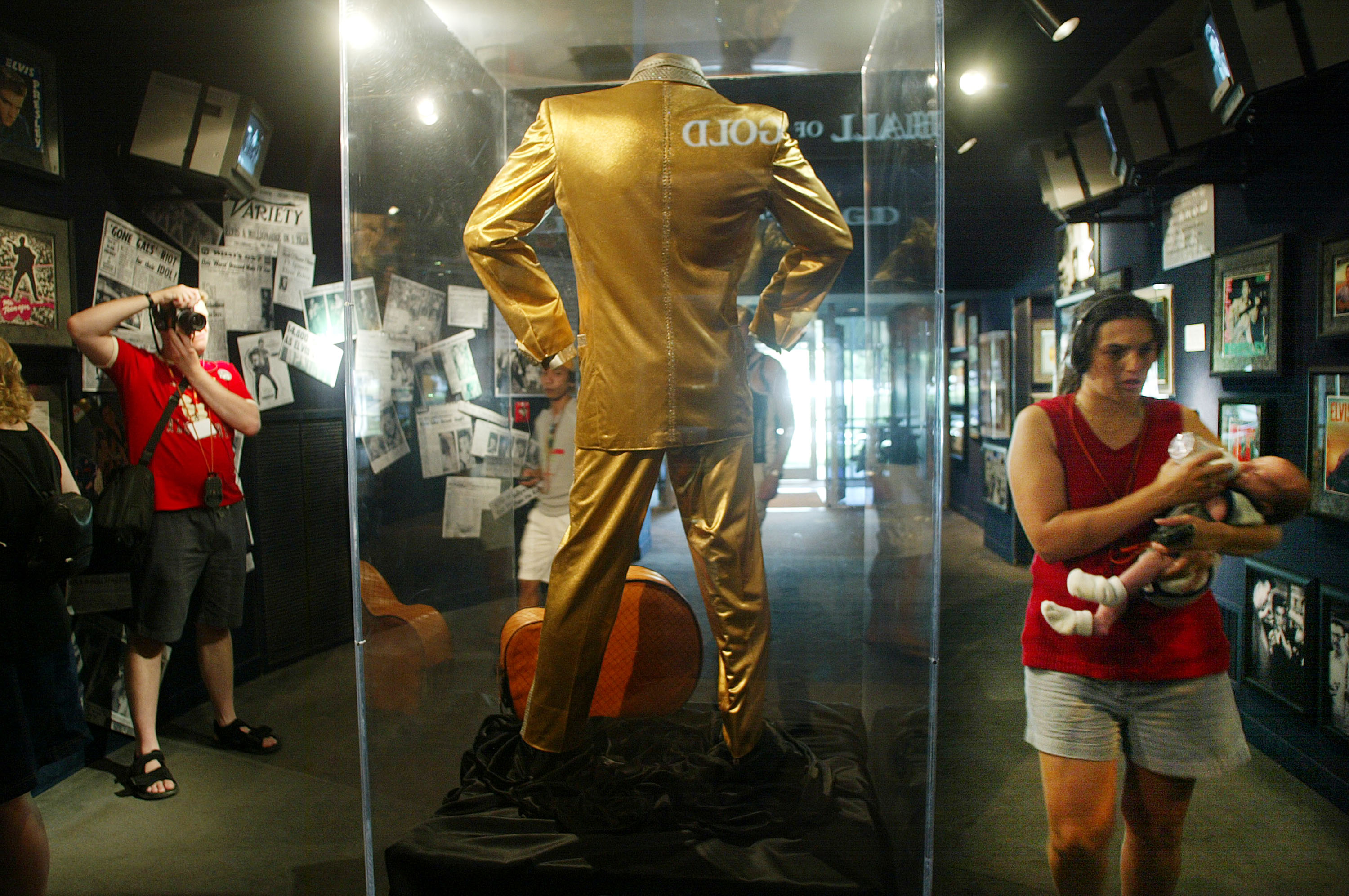 MEMPHIS, TN - AUGUST 12:  A fan photographs Elvis Presley