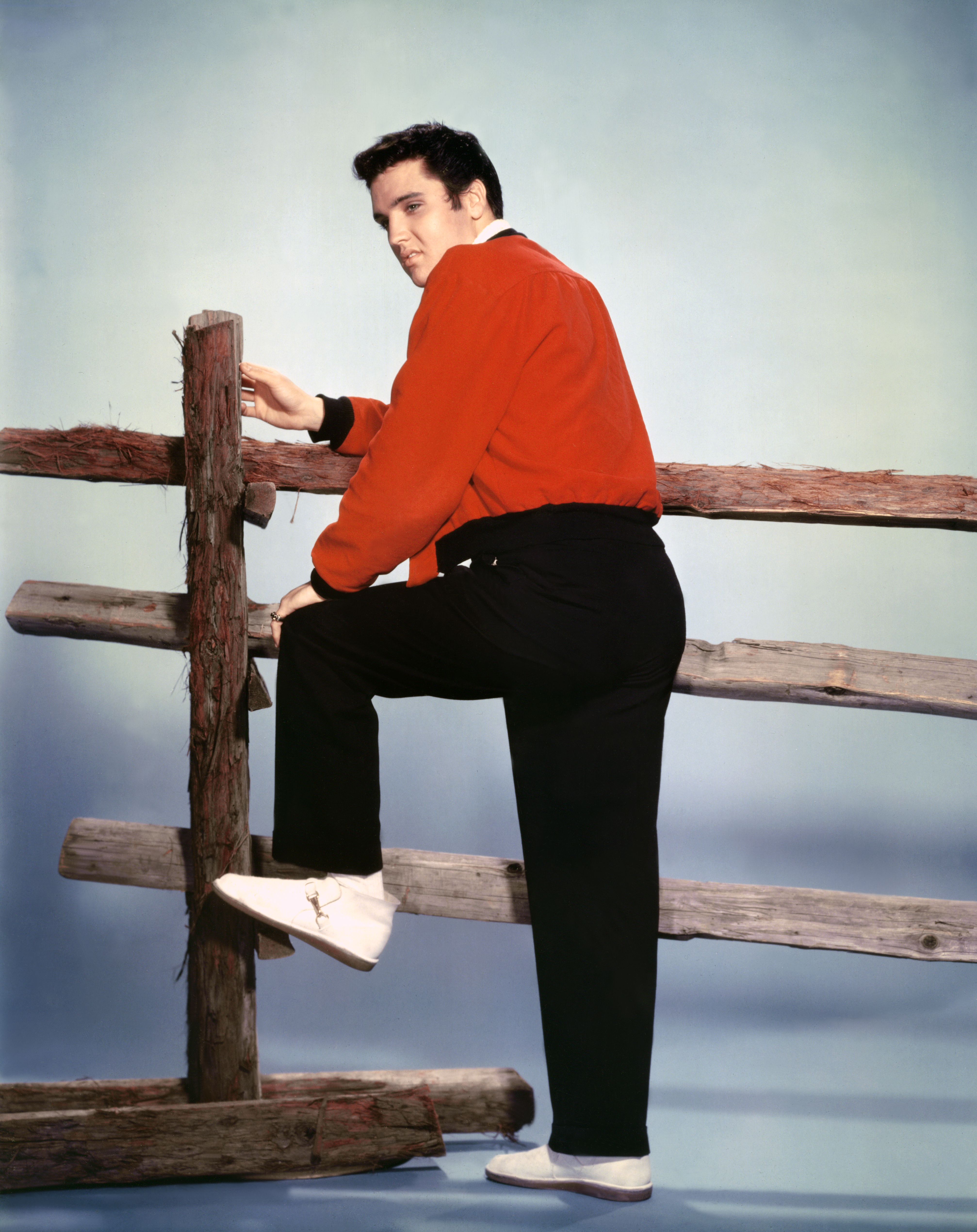 American singer and actor Elvis Presley on the set of Jailhouse Rock, directed by Richard Thorpe. (Photo by Metro-Goldwyn-Mayer/Sunset Boulevard/Corbis via Getty Images)
