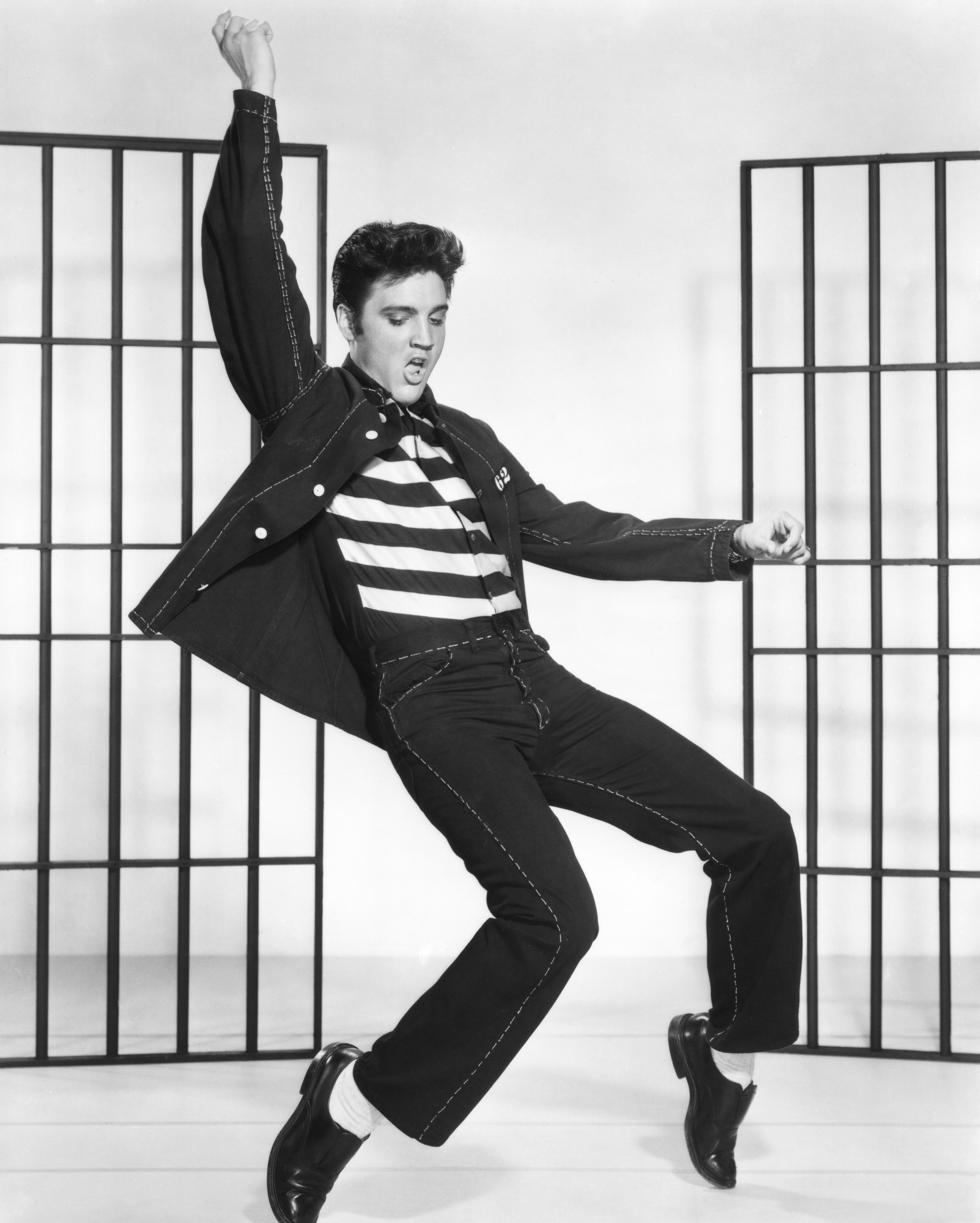 American singer and actor Elvis Presley on the set of Jailhouse Rock, directed by Richard Thorpe. (Photo by Metro-Goldwyn-Mayer/Sunset Boulevard/Corbis via Getty Images)