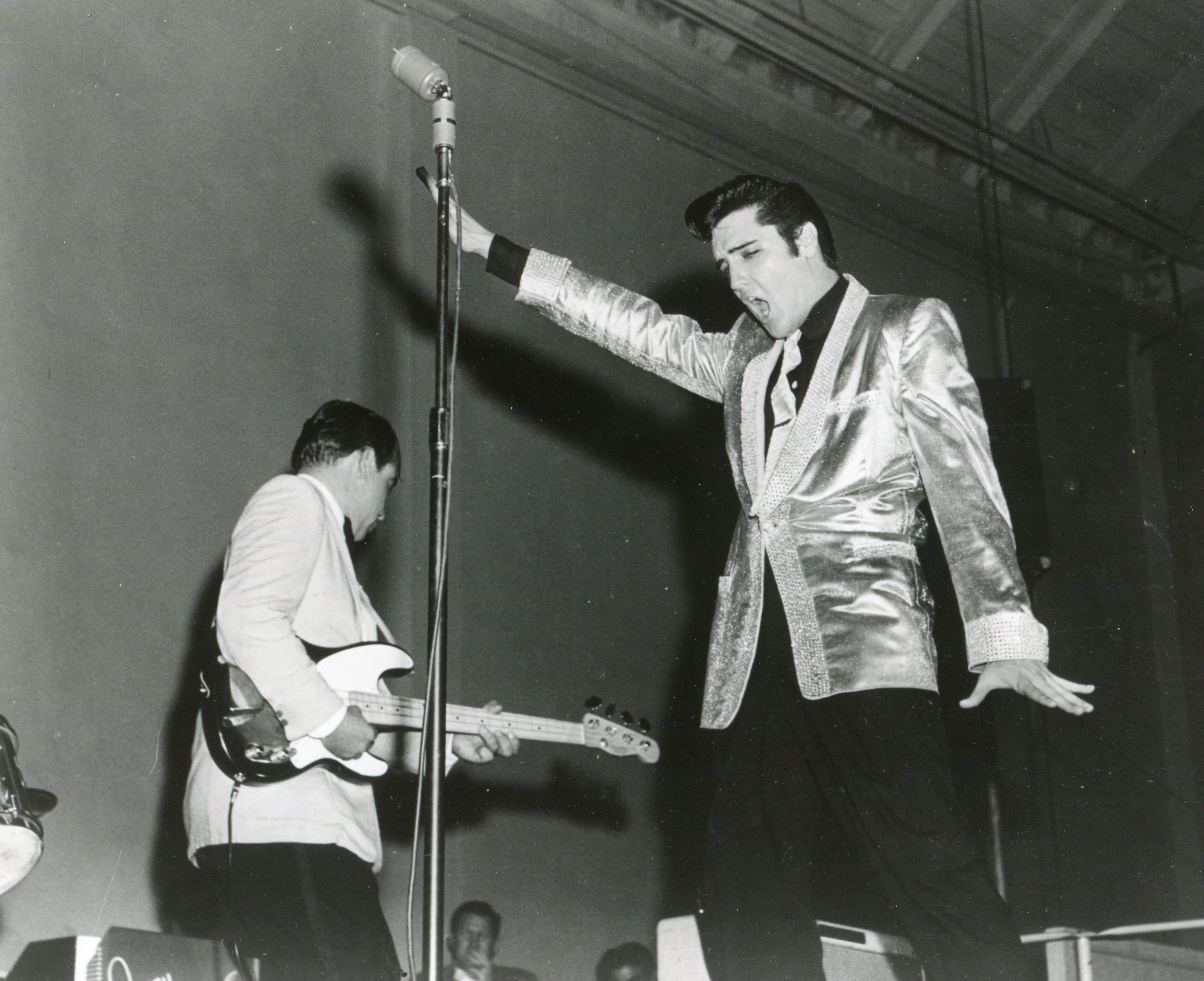 Elvis Presley and Bill Black perform on stage at the Louisiana Hayride, United States, 1956. (Photo by Mark and Colleen Hayward/Getty Images)
