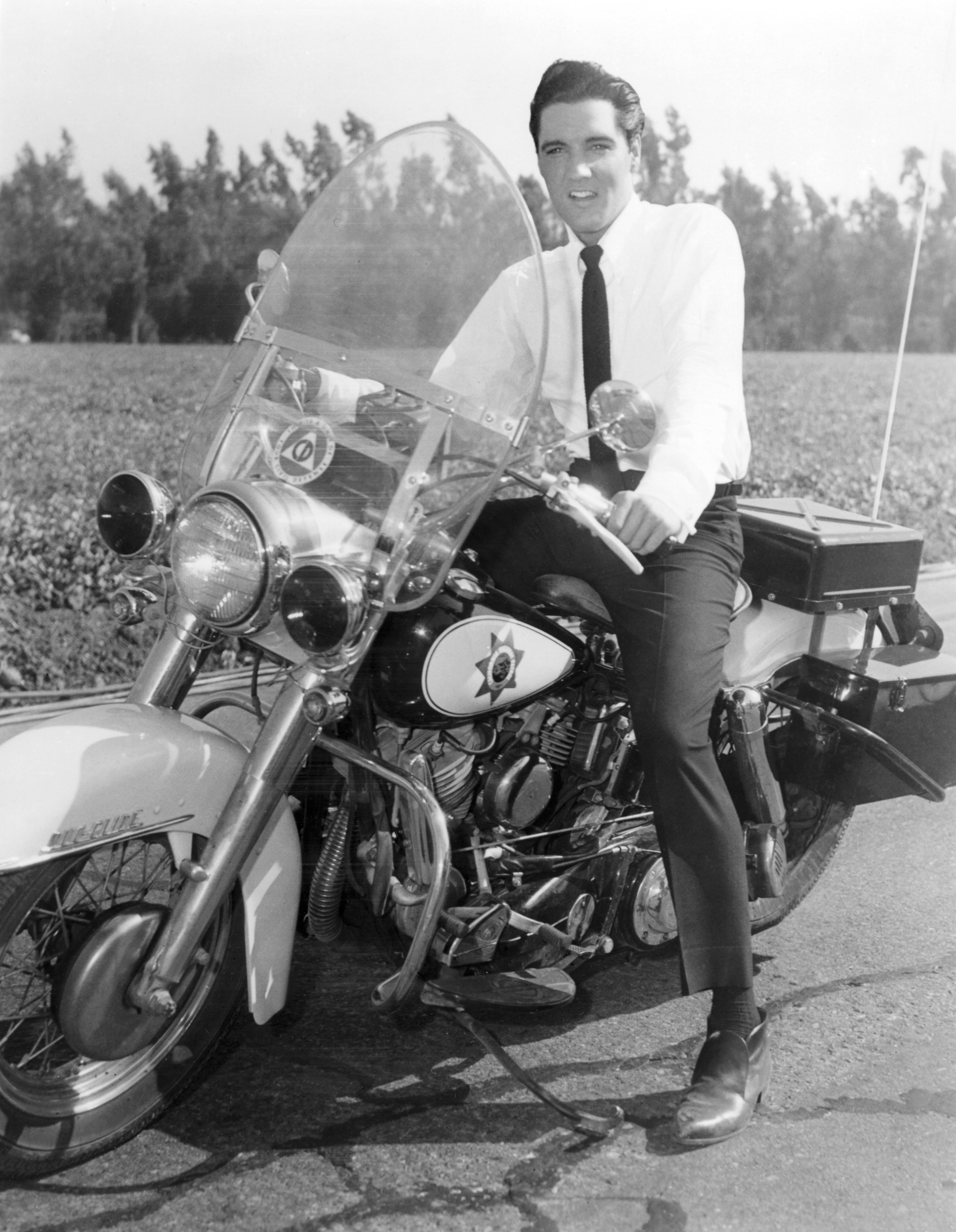Elvis Presley on police motorcycle during movie It Happened at the World