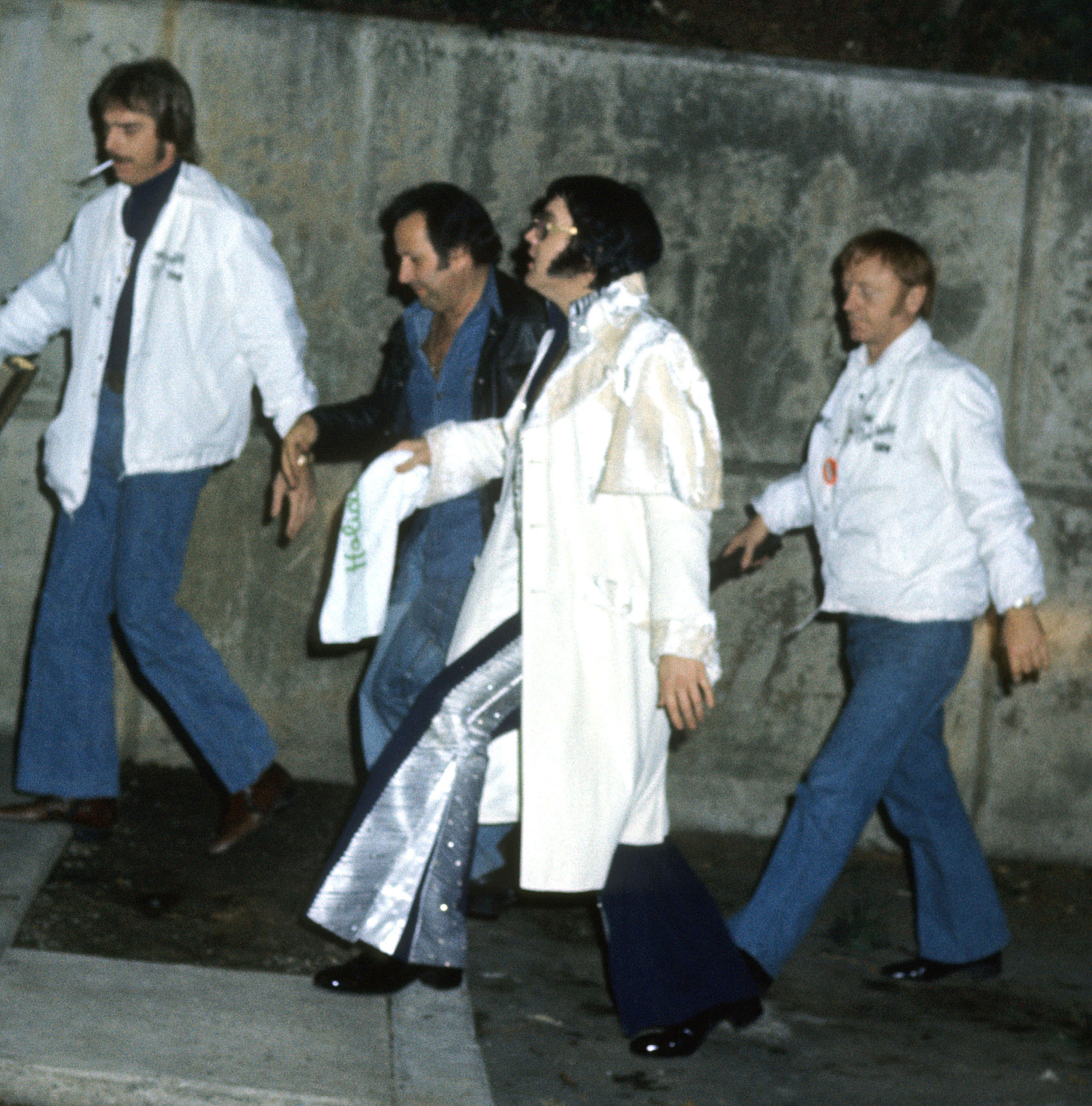 Elvis Presley with his bodyguards during Elvis Presley Arrives At Hotel After Concert - March 17, 1976 at Hilton Inn, Johnson City, Tennessee in Johnson City, United States. (Photo by Tom Wargacki/WireImage)