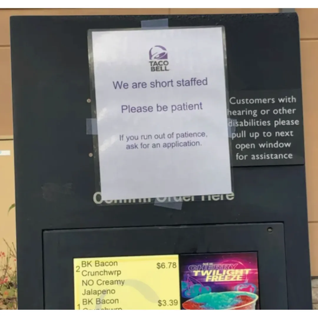 sign on taco bell letting people know they can apply for a job in they get impatient waiting
