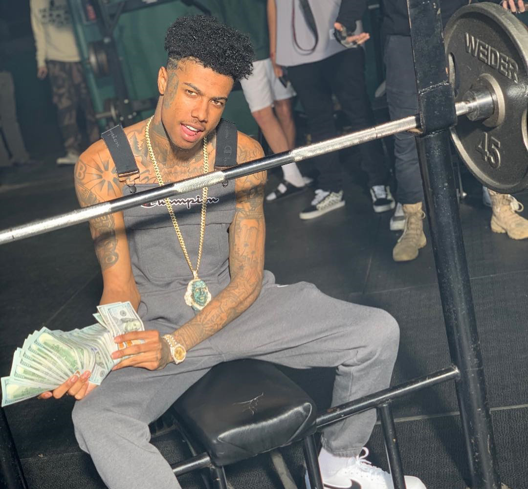 Blueface holding a lot of money Blueface holding a lot of money