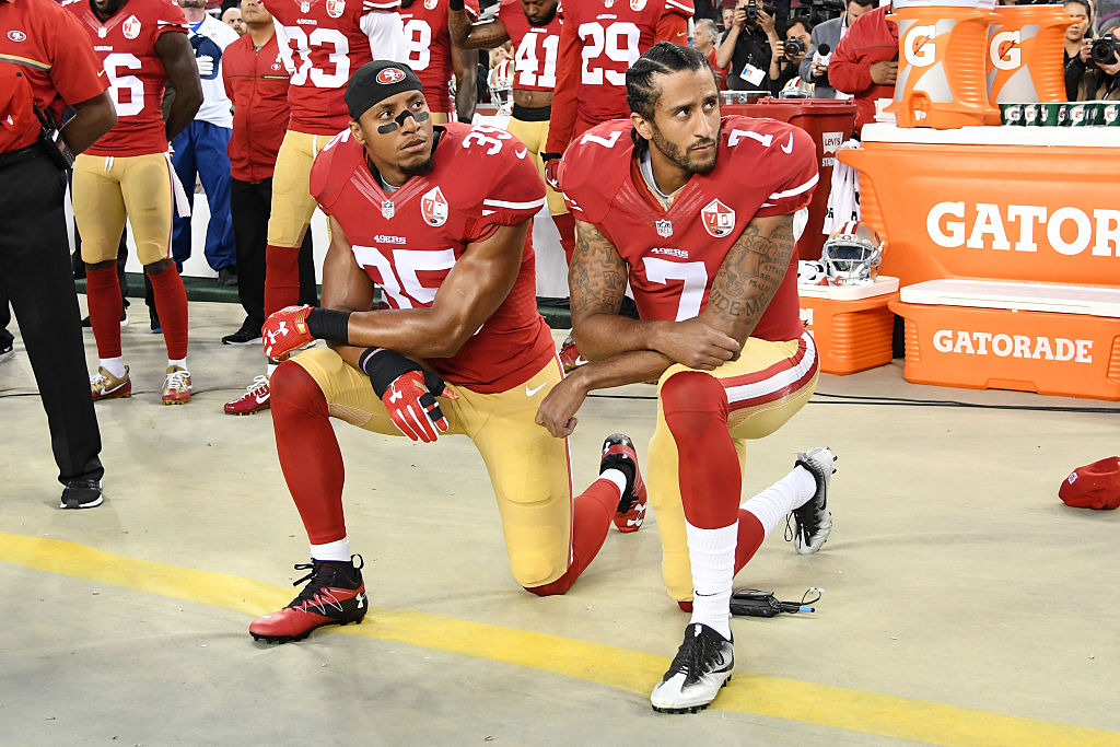 San Francisco 49ers kneel in protest during the national anthem prior to playing the Los Angeles Rams in their NFL game-603553668 San Francisco 49ers kneel in protest during the national anthem prior to playing the Los Angeles Rams in their NFL game-603553668