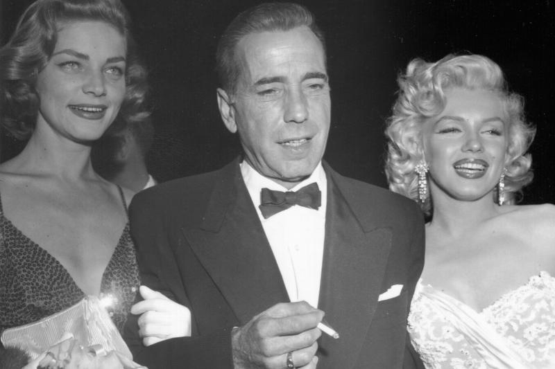 Actors Marilyn Monroe and Humphrey Bogart and Lauren Bacall attend the premiere of her movie 