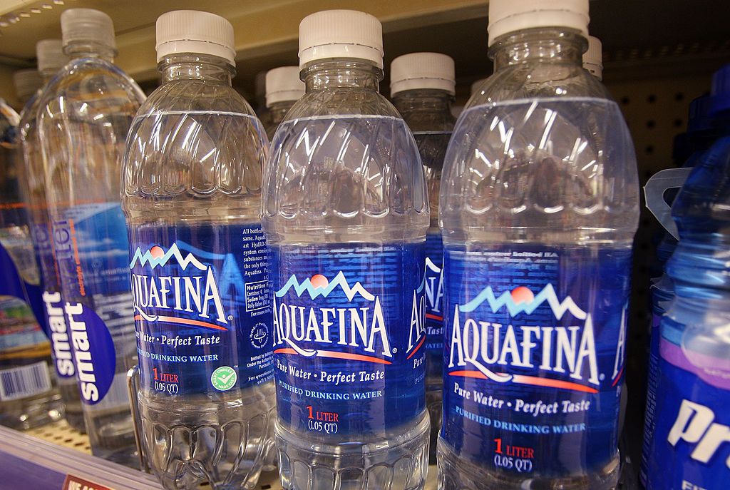 Bottle of Pepsi's Aquafina water sits on a shelf next to other brands of bottled water at a Walgreens store-75817758 Bottle of Pepsi's Aquafina water sits on a shelf next to other brands of bottled water at a Walgreens store-75817758
