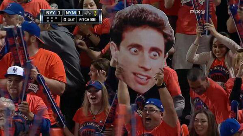 seinfeld sign baseball a fan with a seinfeld sign at a new york game