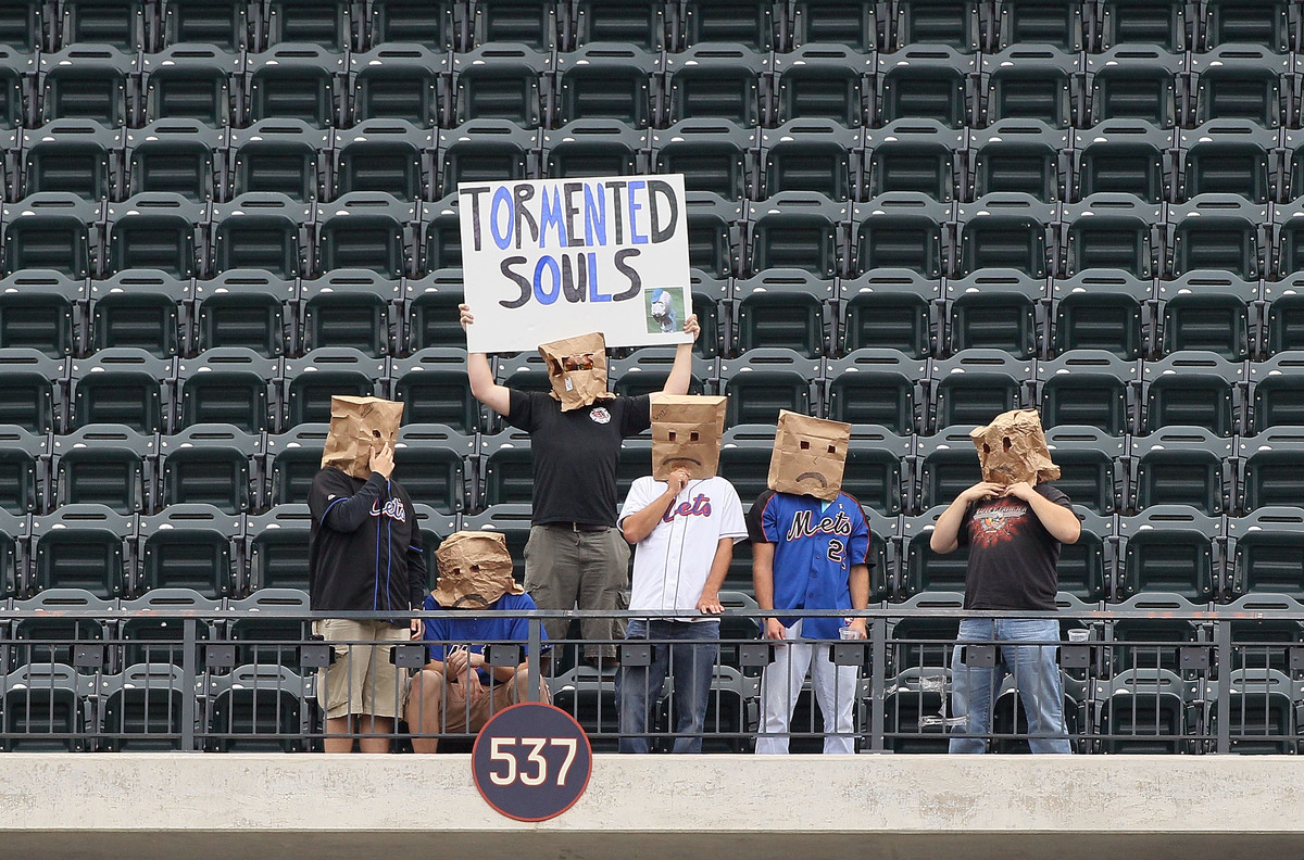 mets fans paper bags-127517148 Fans of the New York Mets sit alone in the upper deck during the game against the Cincinnati Reds at Citi Field on September 28, 2011 in the Flushing neighborhood of the Queens borough of New York City.