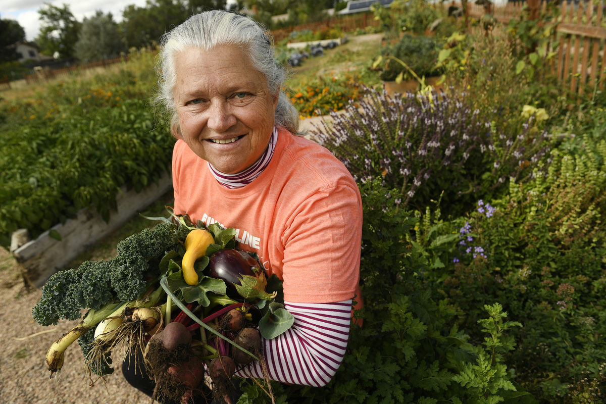 garden woman proud of veggies she grew