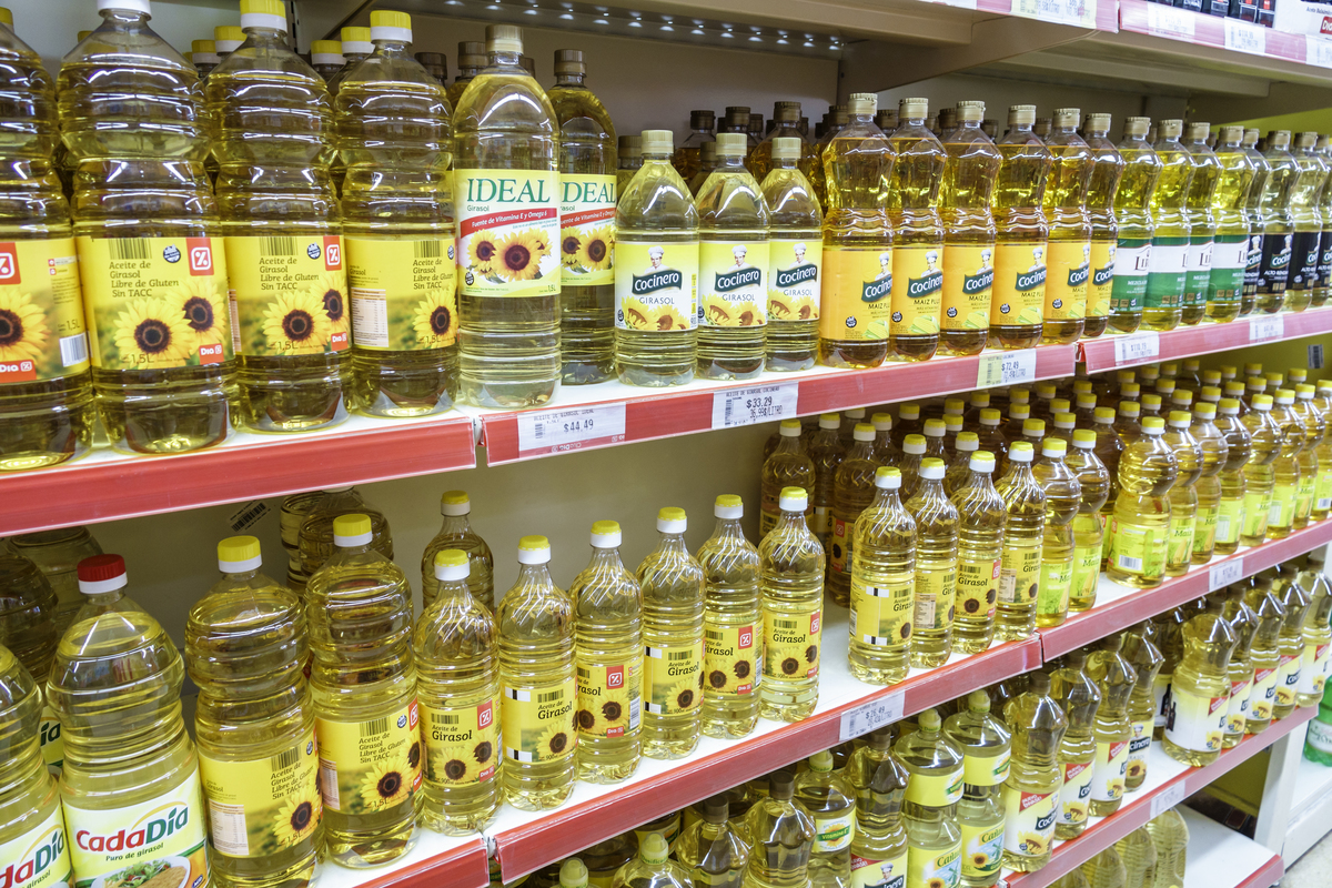 vegetable oil nails-982736180 Shelves of sunflower oil for sale in a supermarket in San Telmo.