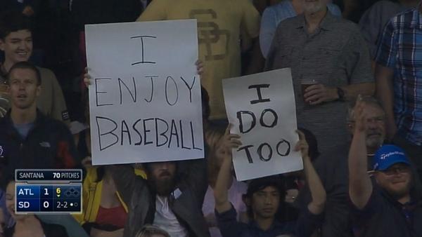 i enjoy baseball sign a fan holding a sign that reads i enjoy baseball