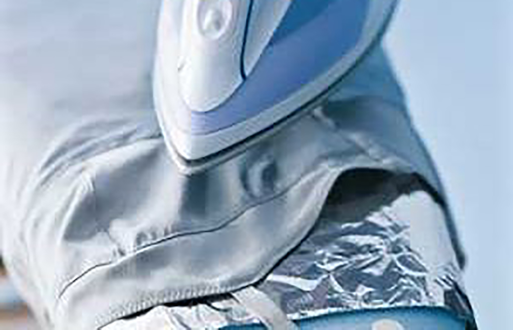Ironing Foil beneath the clothes while ironing