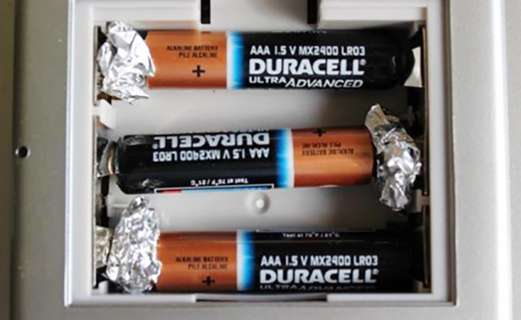 Battery Power Aluminum foil pressed against battery