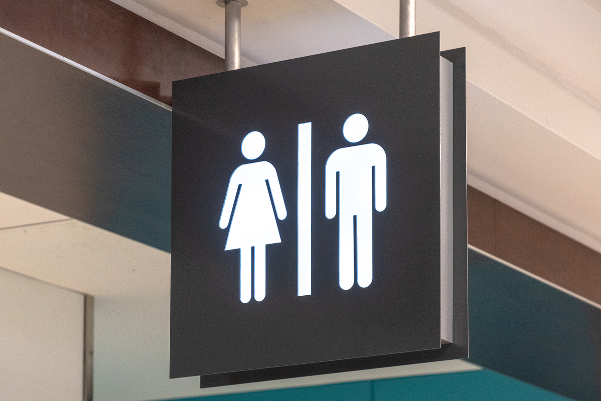 bathroom signs - 1094160180 Public washroom or bathroom sign hanging from the ceiling of Pearson International Airport.