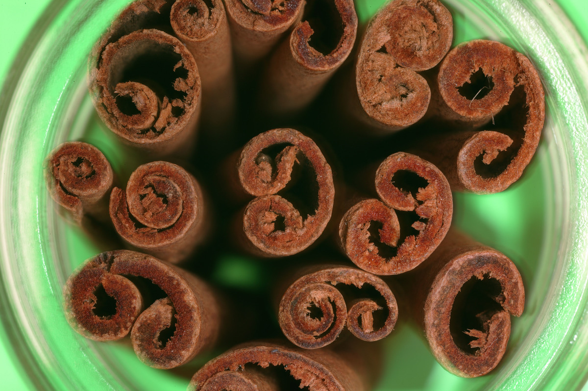 cinnamon sticks - 1126677154 Cinnamon sticks are held in a mint-colored container.