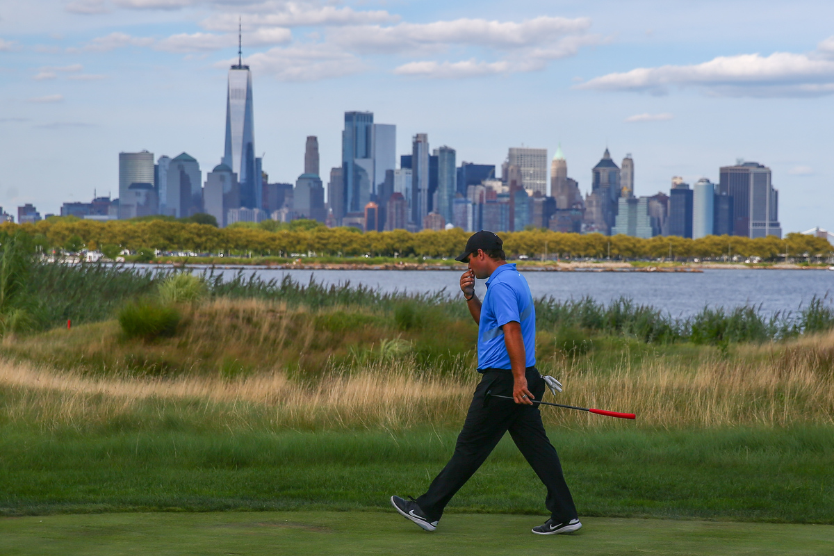 Liberty National - 1161469706 Patrick Reed walks down the 14th fairway at Liberty National Golf Club in Jersey City, NJ.