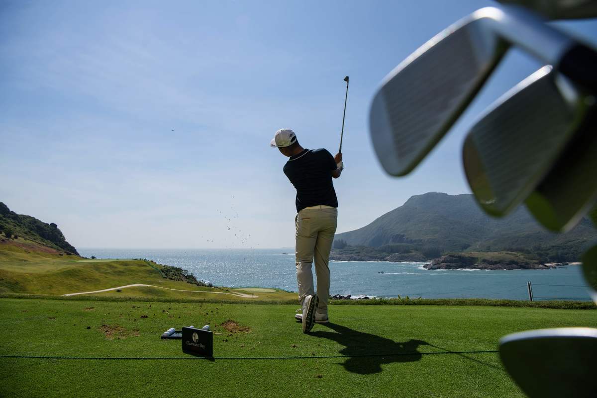golfing Clearwater - 869586580 Chinese golfer Lin Yuxin warms up on the driving range prior to teeing off at the first hole at the Clearwater Bay Golf Club in Hong Kong.