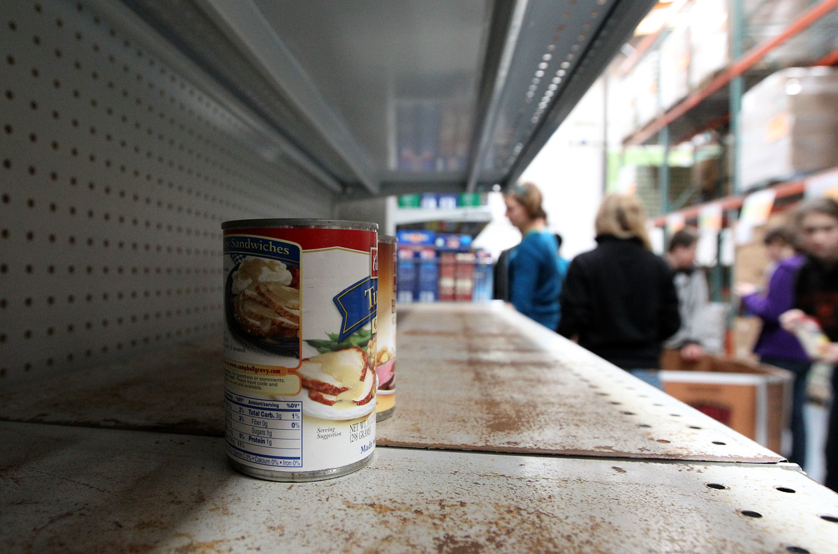 canned food - 93331319 Canned food sits on the shelf at the San Francisco Food Bank.