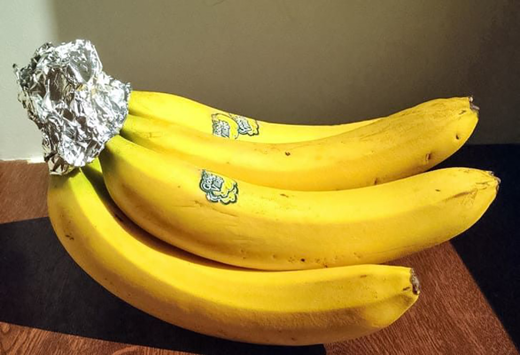 Bananas Aluminum foil wrapped around banana stem