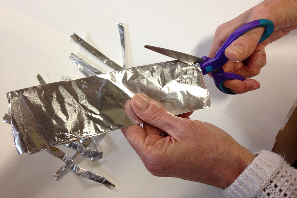 Sharp Scissors Cutting aluminum foil with scissors