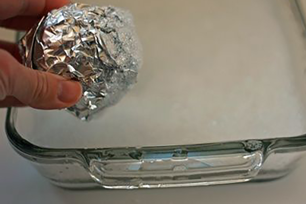 Foil To Clean Dishes Ball of aluminum foil used to scrape dish