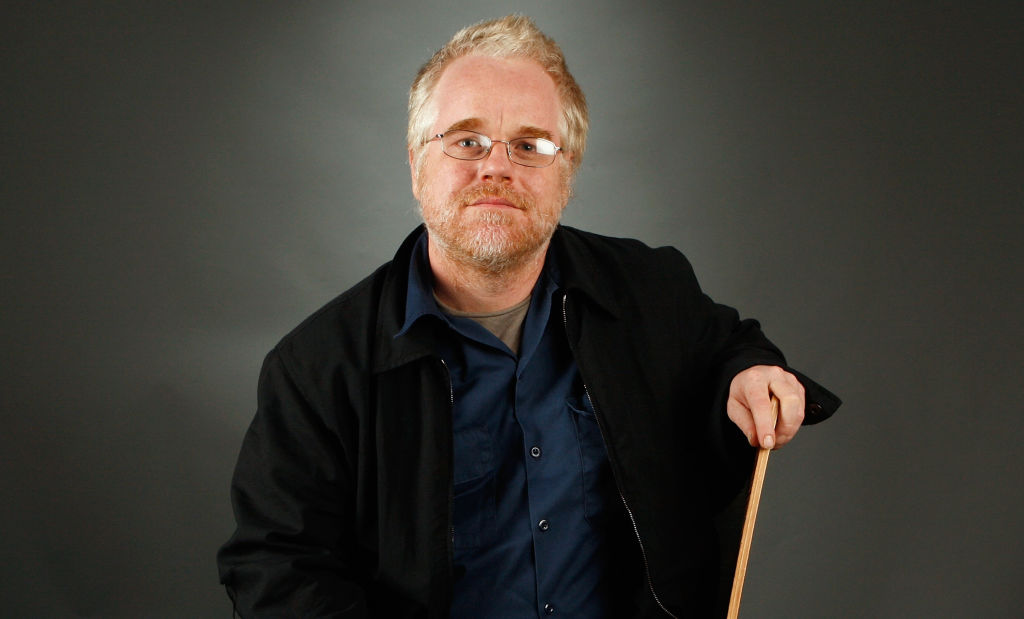 Philip Seymour Hoffman-77834335 sitting an a chair