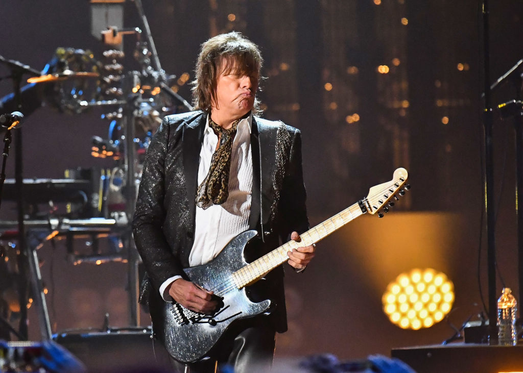 Now, Richie Sambora Is Trying To Rock His Guitar And A Mullet