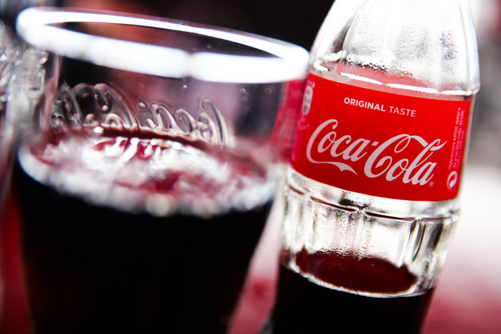 soda 1168574326 a glass and bottle of coca-cola