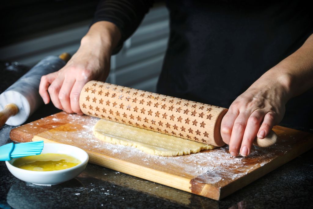 white flour 957713674 woman making a pie from flaky pastry dough