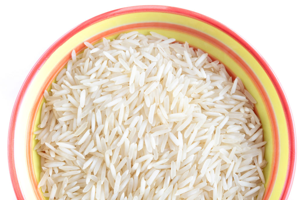 white rice 1158336481 white rice in a yellow and pink ceramic bowl