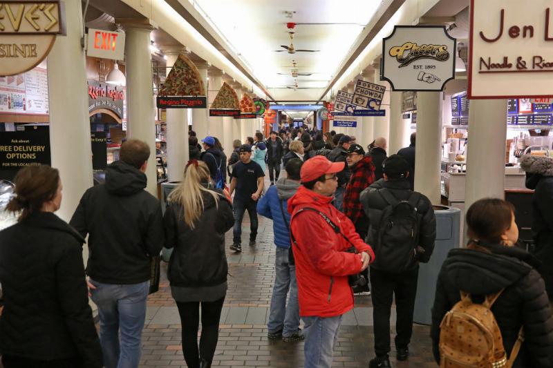 Faneuil Hall and Quincy Market a crowd lining up for food at Faneuil Hall and Quincy Market