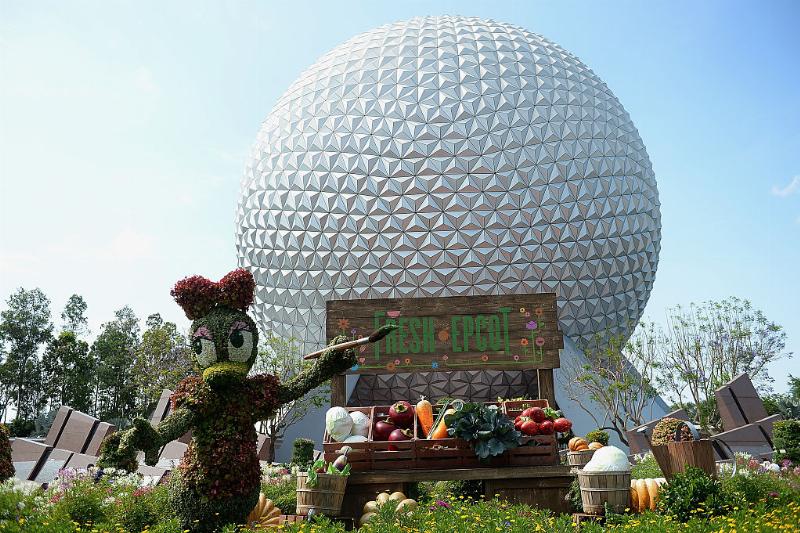 epcot 530879254 a flower sculpture of daisy duck in front of the epcot center at walt disney world