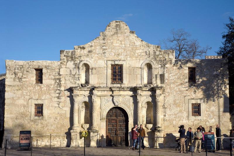 the alamo 1084561606 tourists posing for photos outside the alamo