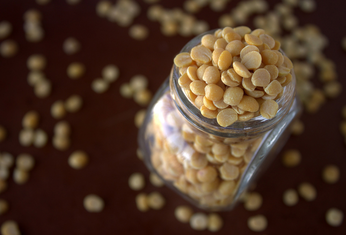 legumes A jar is filled with dried lentils.