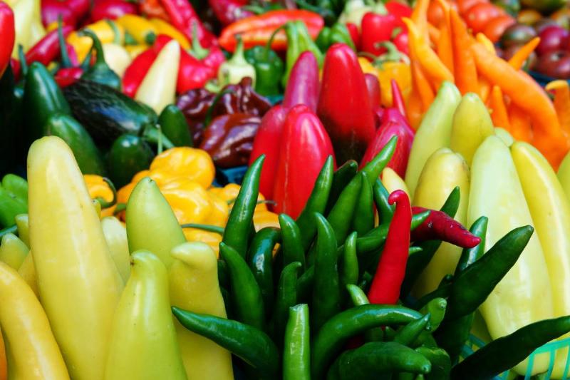 hot peppers-1189390379 Colorful hot peppers are on display at a market.