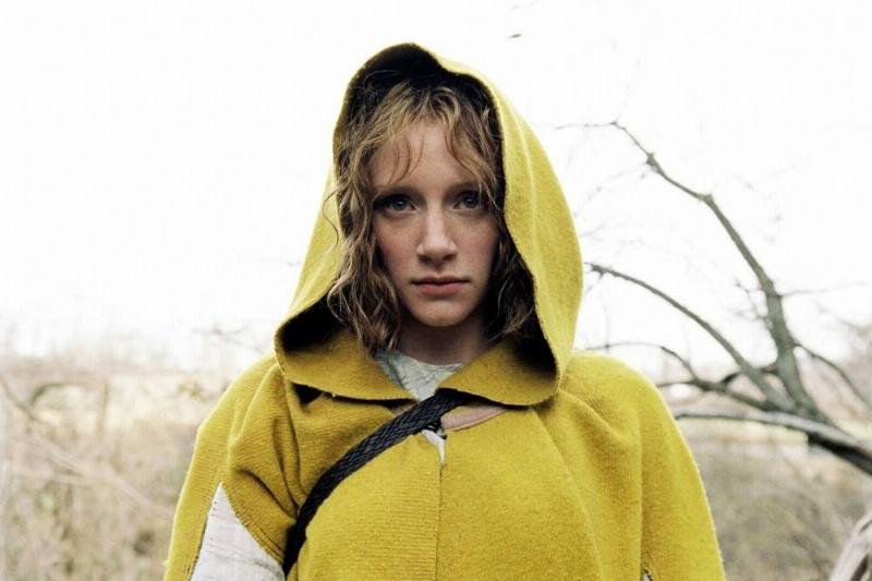 Woman in a yellow coat 