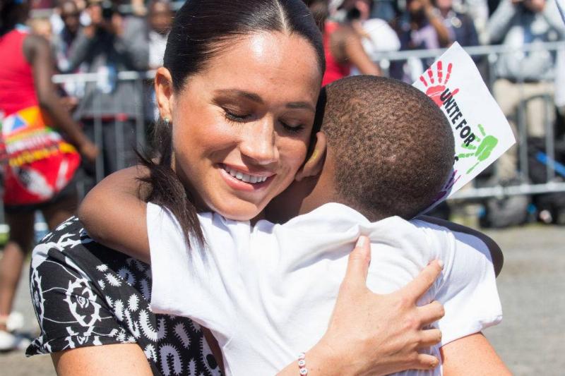 Meghan-hugs-child-1176960486-73864 Meghan-hugs-child-1176960486-73864