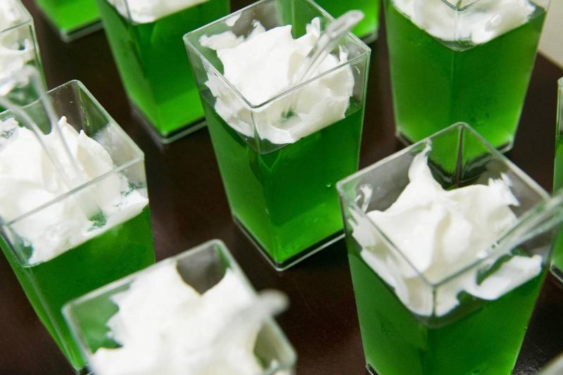 jello - 115623390 Containers of jello and cream are served as dessert.