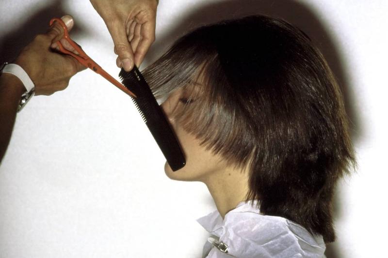 cutting hair -1165525578 A model gets her hair cut.