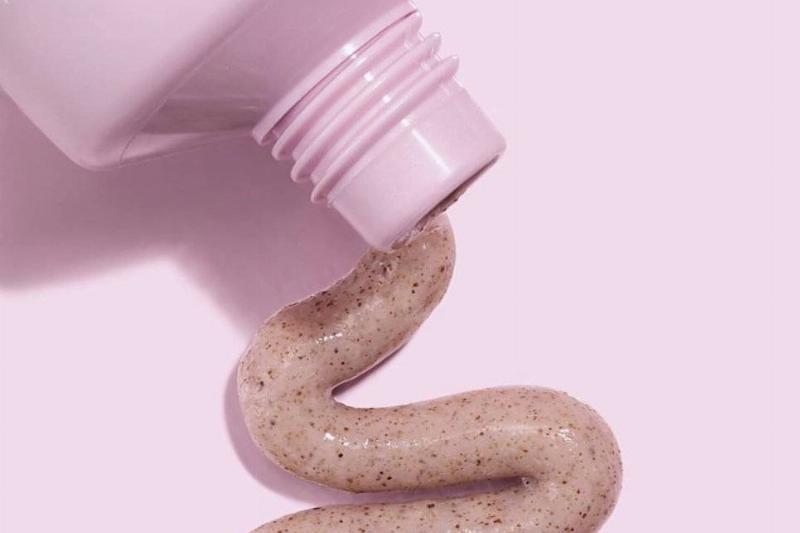 walnut scrub Walnut scrub is poured out of a pink tube.