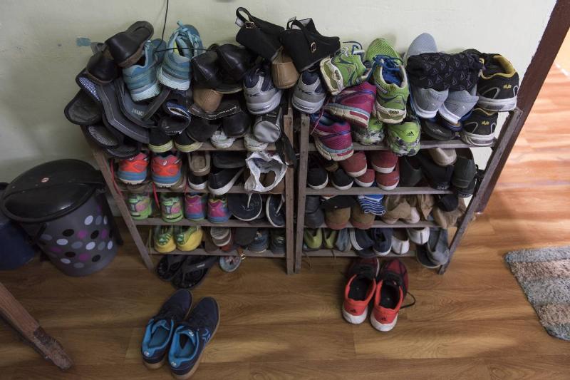 GettyImages-613164912 shoe rack at home shoe rack by front door