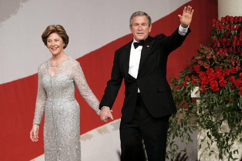 Bush second inauguration-52041007 George and Laura Bush wave at the crowd during the 2005 inauguration.