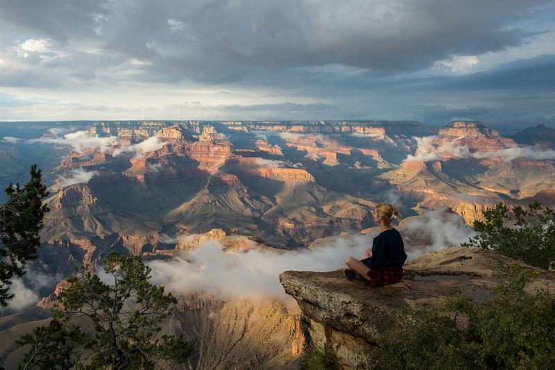 Woman sitting on a rock 