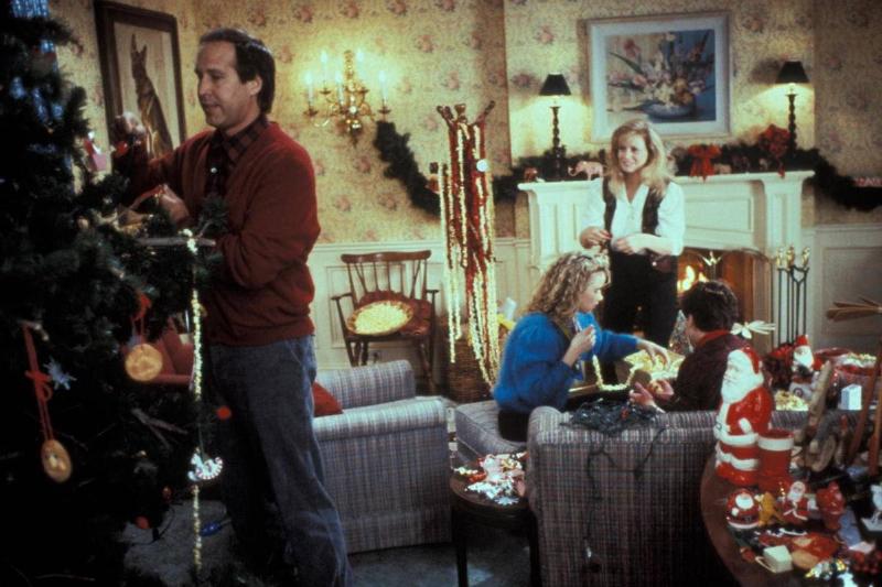 christmas decorating In this still from Christmas Vacation, the Griswold family decorates for Christmas.