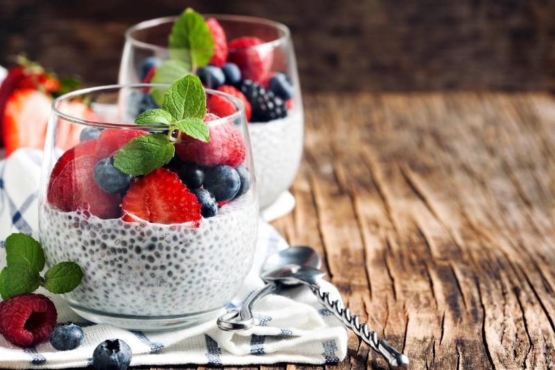Chia seed pudding Cups of chia seed pudding are topped with berries and mint.