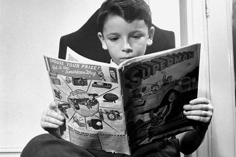 Boy reading a comic book 