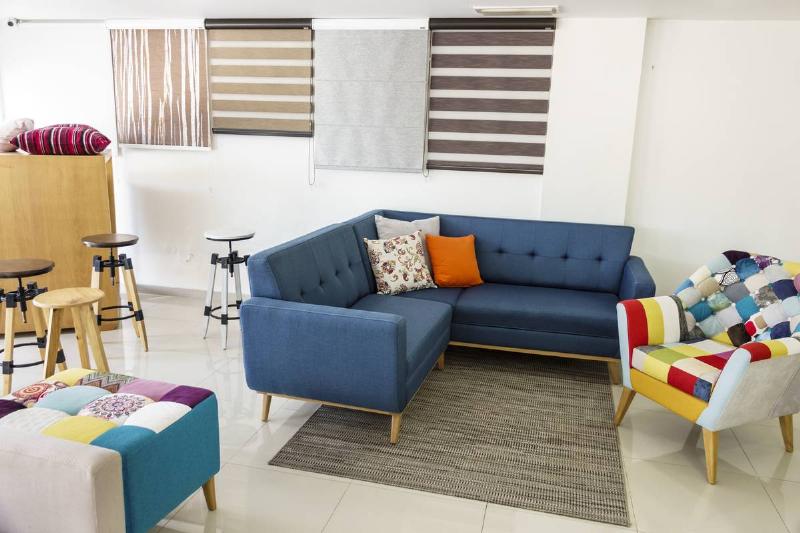 GettyImages-1189380013 display of upholstered furniture display of upholstered furniture in bright colors in store