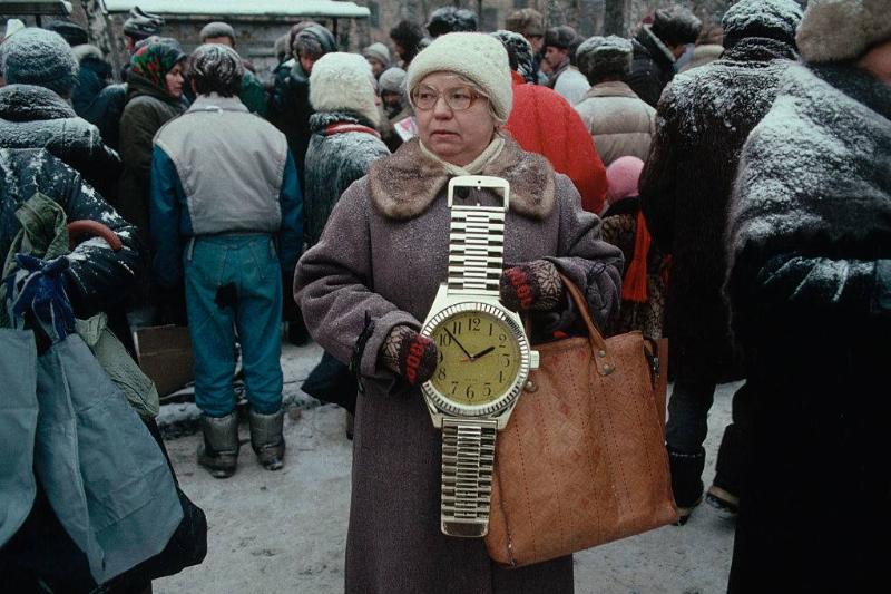 Woman holding clock 