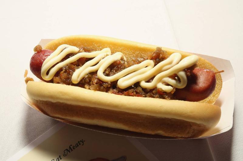 hot dog A hot dog is displayed with a pamphlet during a food competition.